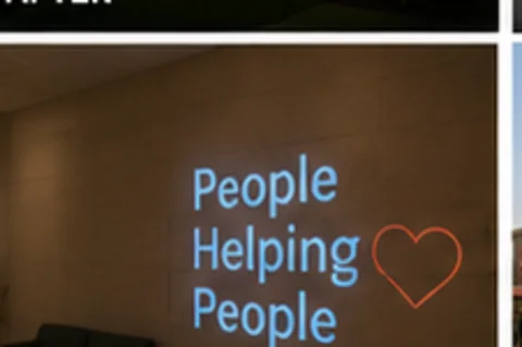 People Helping People projected on the wall in light