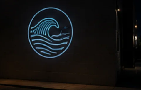 Wave Badge projected on the wall in light