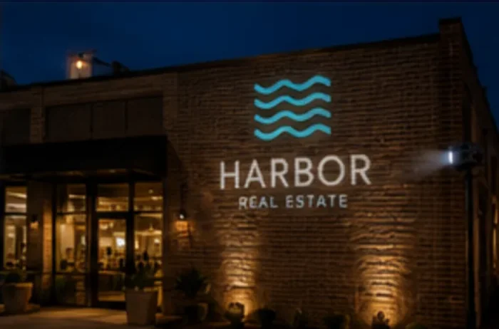 Logo projected on a storefront at night — Infinity Projectors