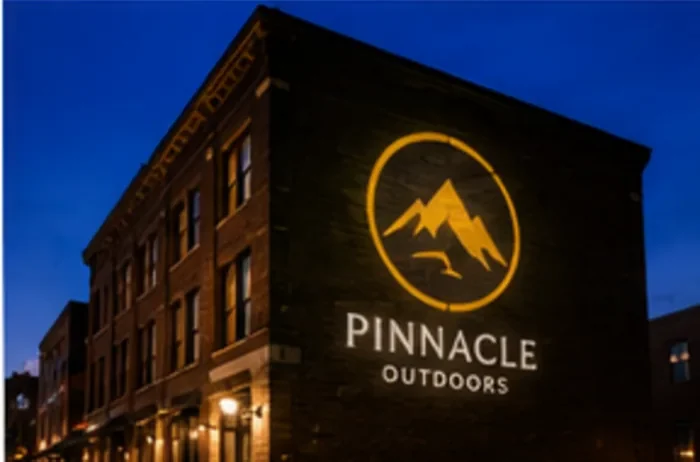 Brand logo projected up a building exterior — Infinity Projectors