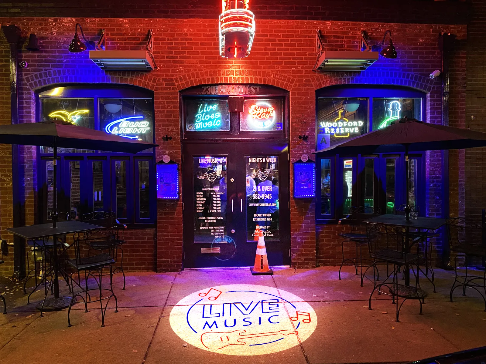 Logo projected at a bar entrance — an Infinity kit in action