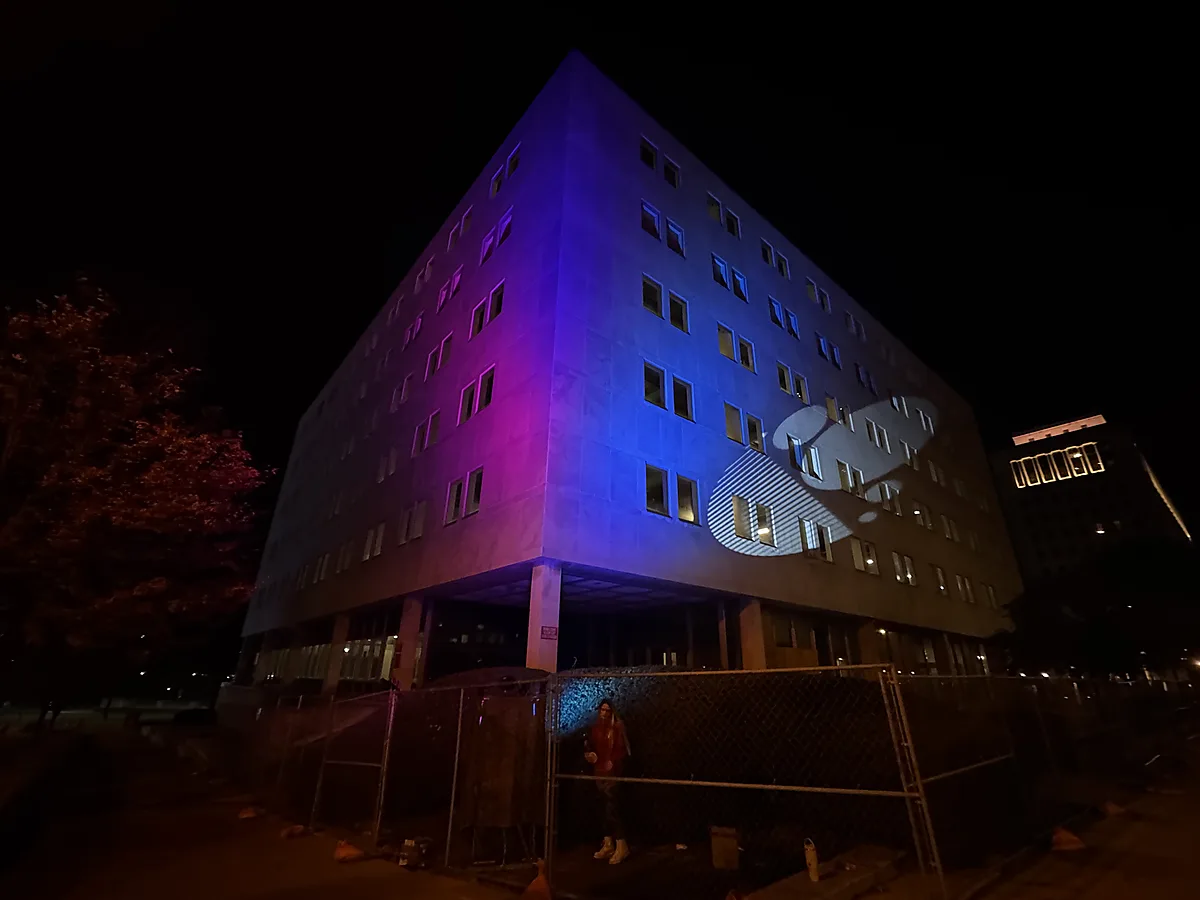 Abstract branded projection in an office building interior