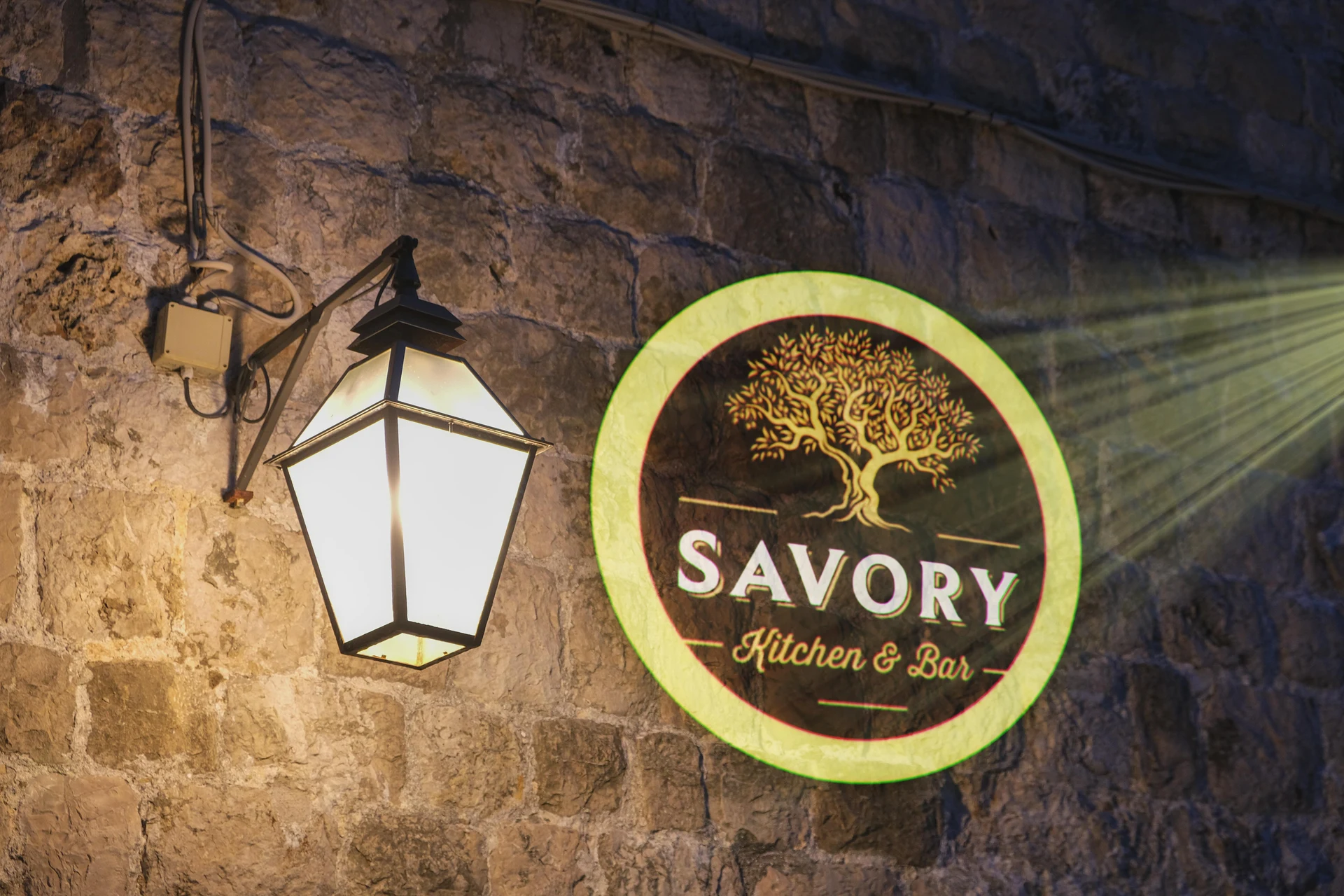 Restaurant logo on rustic stone — Infinity gobo logo projection