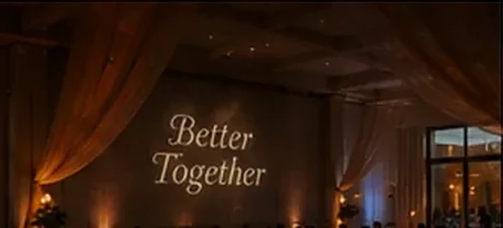 "Mr & Mrs" projection over an elegant candlelit reception — Infinity Projectors