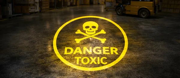 Danger toxic hazard symbol projected on a warehouse floor