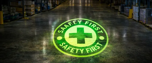 Safety-first symbol projected on a warehouse floor