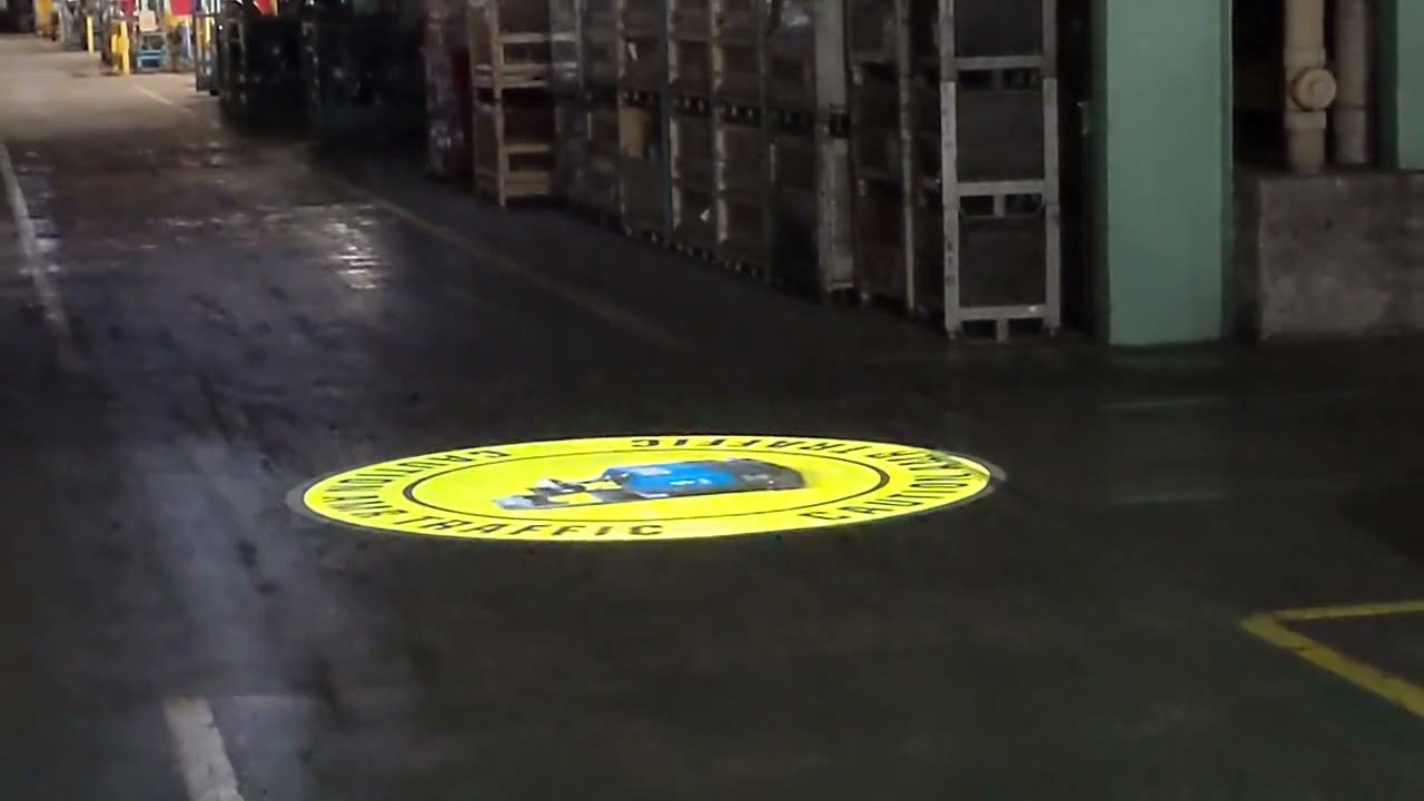 Forklift traffic caution gobo on a warehouse floor